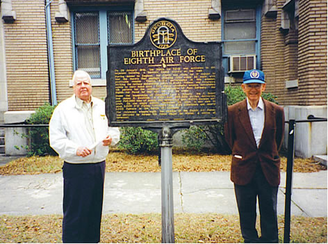 two elderly men with plaque that reads Birthplace of the Eighth Air Force