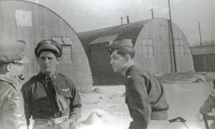 Lt. Nick P Dear, Bombardier (middle) and Lt. Bill Owen, Pilot (right) -officer with pipe unknown