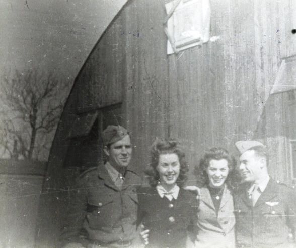 Officers of the 482nd BG have picture taken with Red Cross women - Alconbury