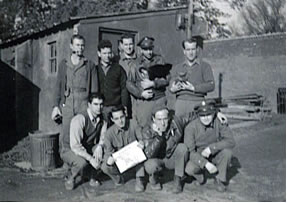 Nine men of the 482nd air and ground crew in an outdoor group photo